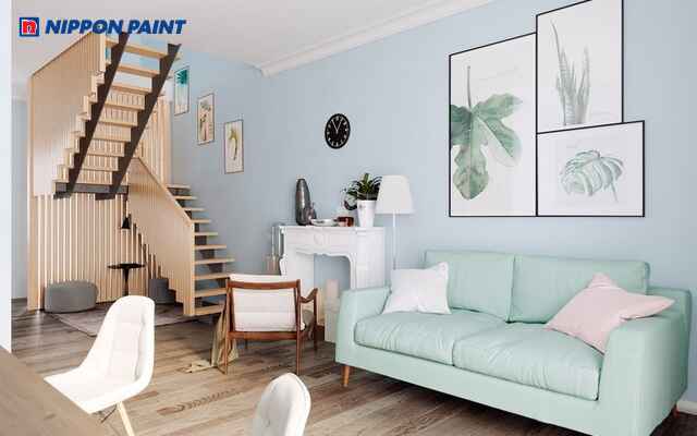 Phòng khách mang gam xanh pastel chủ đạo, tạo cảm giác dịu mắt, thư giãn và thanh lịch