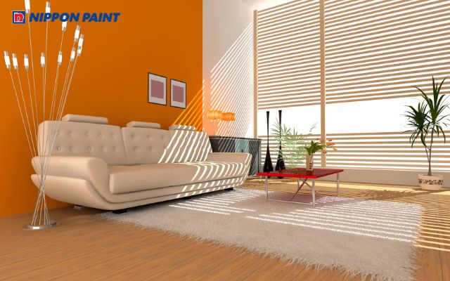 Phòng khách tươi sáng với màu cam đất nổi bật, tạo không gian ấm áp, năng động và gần gũi