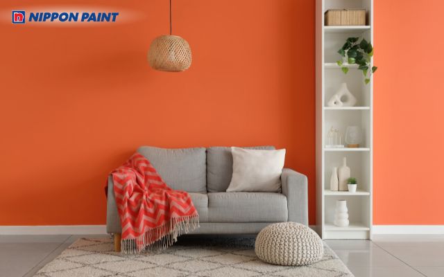 Sử dụng sơn màu cam giúp phòng khách trở nên sinh động, tươi mới và tràn đầy sức sống