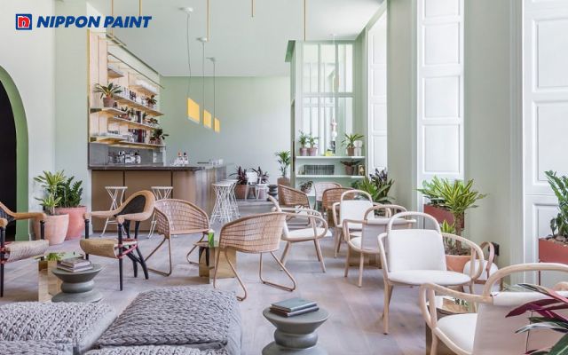 Quán cà phê văn phòng với màu sơn xanh pastel tươi mát, tạo cảm giác thư thái, dễ chịu