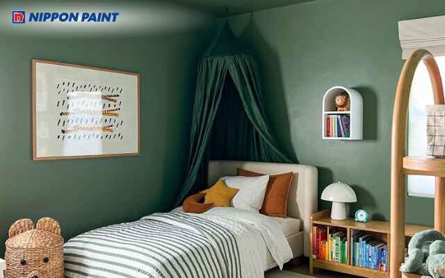 Phòng ngủ bé trai sử dụng màu xanh lá cây tạo không gian tươi mới và gần gũi thiên nhiên