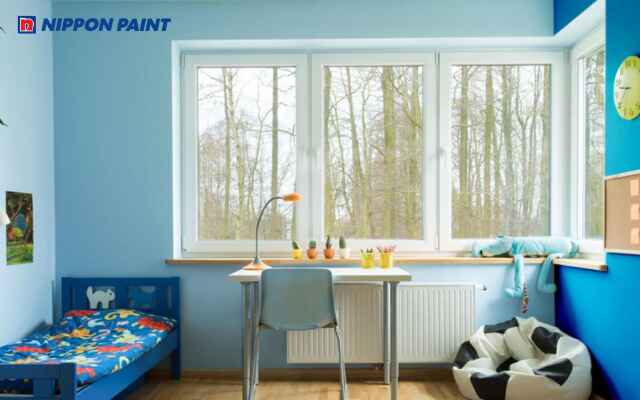 Kết hợp xanh da trời với vàng nhạt giúp tạo sự vui tươi và sinh động trong phòng bé trai