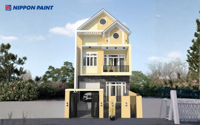 Mẫu nhà phố sơn ngoại thất màu vàng kem nhạt nổi bật và tràn đầy năng lượng