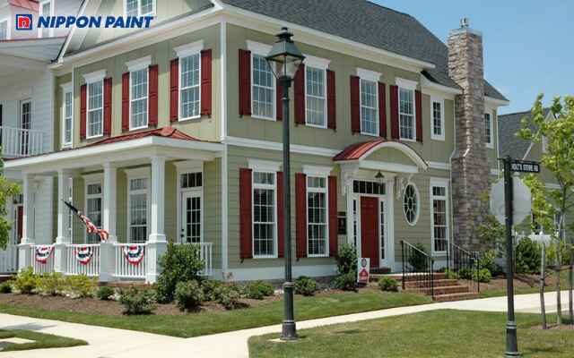 Mẫu 4: Ngoại thất biệt thự tân cổ điển với gam xanh lá cây nổi bật và không gian xanh mát