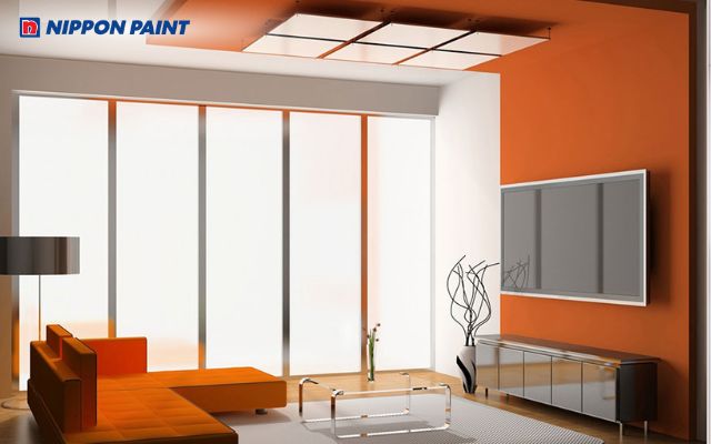 Mẫu trần bê tông đẹp với tông màu cam nổi bật, mang lại cảm giác trẻ trung, cá tính