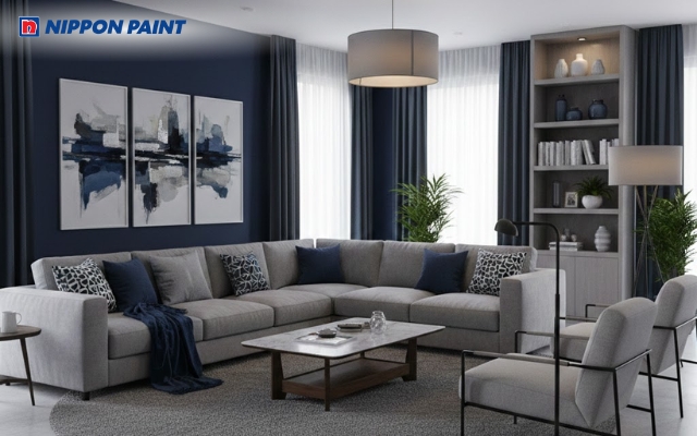 Không gian phòng khách sang trọng hơn với tường xanh navy kết hợp nội thất xám trung tính