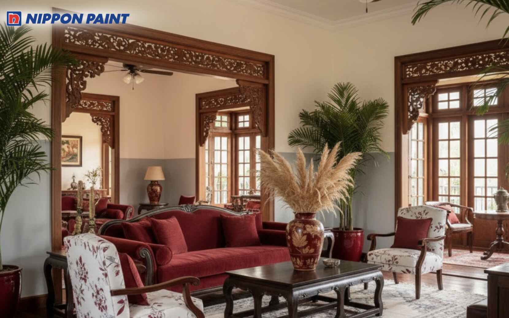 Bảng màu trung tính ấm kết hợp điểm nhấn trầm đậm giúp phòng khách Indochine gần gũi