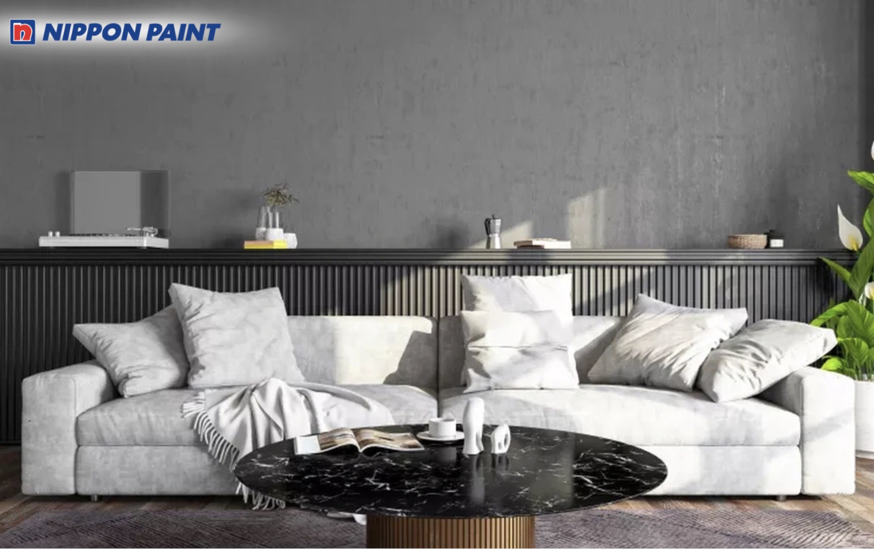 Phối sơn xám bê tông và điểm nhấn đen mờ giúp phòng khách trông mạnh mẽ, hiện đại