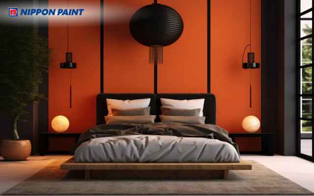 Sơn tường cam kết hợp nội thất đen nhỏ tạo điểm nhấn ấn tượng và phá cách