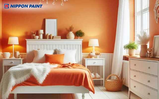 Phòng ngủ màu cam và trắng trang trí phụ kiện đồng bộ, tạo điểm nhấn sinh động