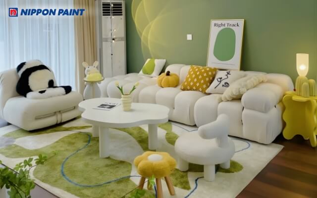 Nội thất phòng khách phối xanh lá qua các chi tiết nhỏ, hài hòa phong thủy