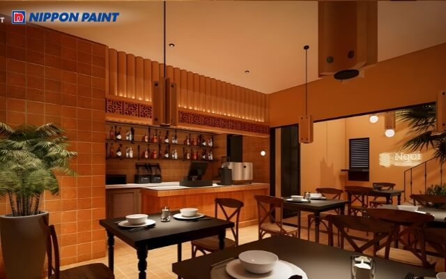 Không gian bếp có màu cam chủ đạo, ánh sáng vàng ấm, cân bằng phong thủy