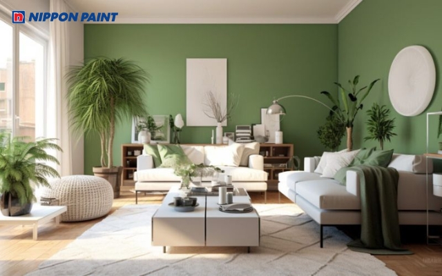 Phòng khách sơn tường màu xanh lá, nội thất gỗ và một vài vật dụng trang trí màu trắng xám