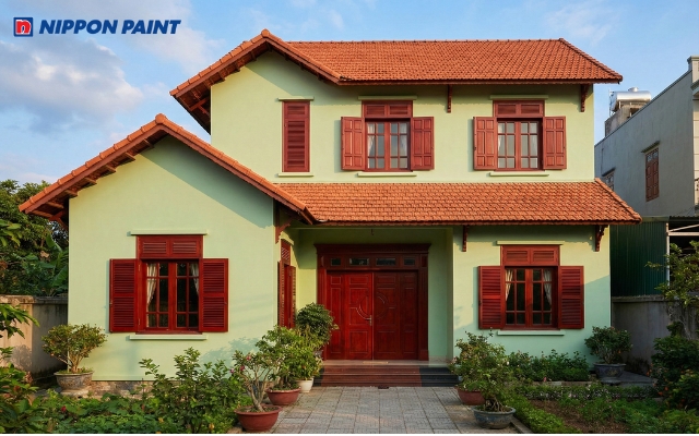 Mặt tiền nhà xanh cốm phối mái ngói đỏ gạch nổi bật