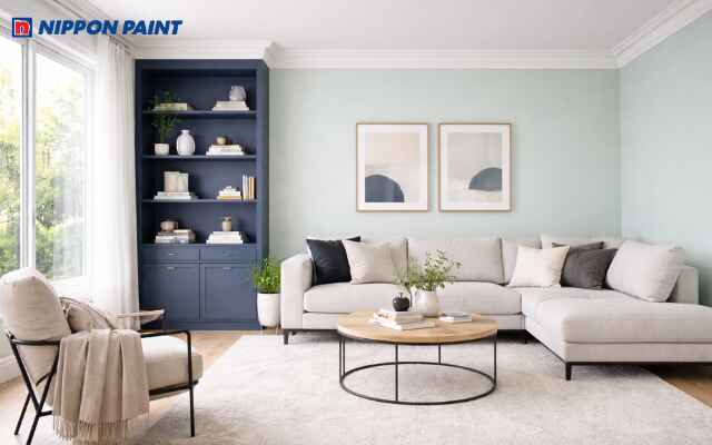 Sự tương phản mạnh mẽ giữa xanh mint và xanh navy tạo chiều sâu hút mắt cho căn phòng