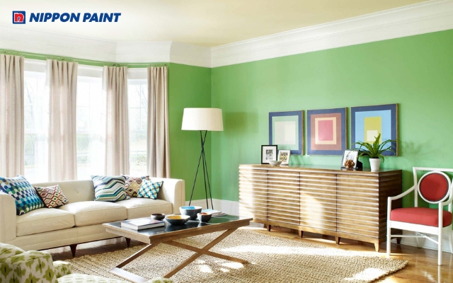 Sơn tường xanh lá kết hợp màu trắng tạo không gian phòng khách sáng sủa, tinh tế và dễ chịu